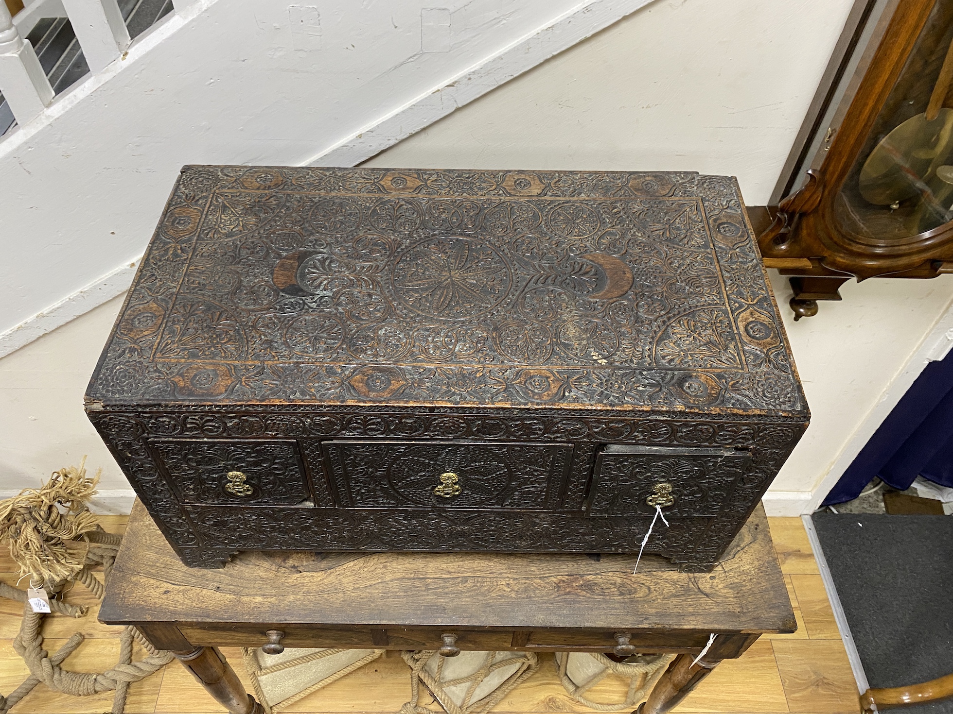 A 19th century rectangular Indian carved hardwood three drawer low table, width 68cm, depth 36cm, height 36cm